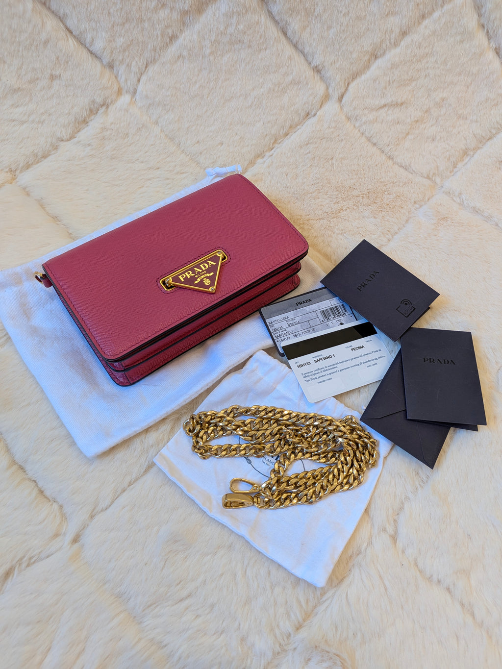 Prada WOC Saffiano Lux Flip Lock Peonia Pink